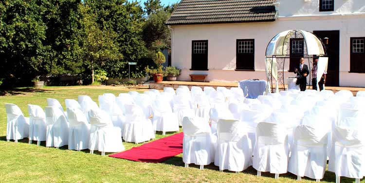 wedding set up with a carpeted walkway