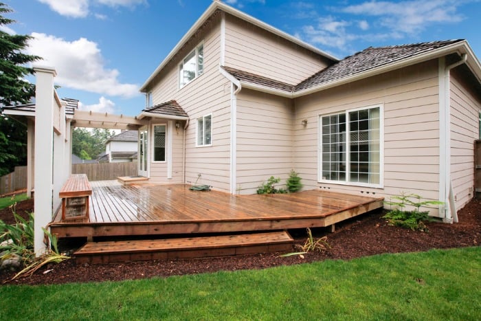 wooden deck in backyard cover dirt