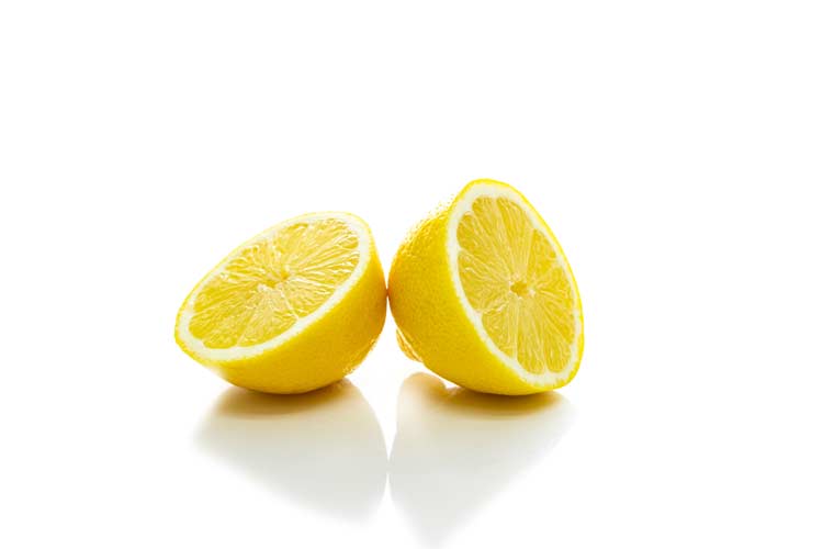 isolated lemon cut in half