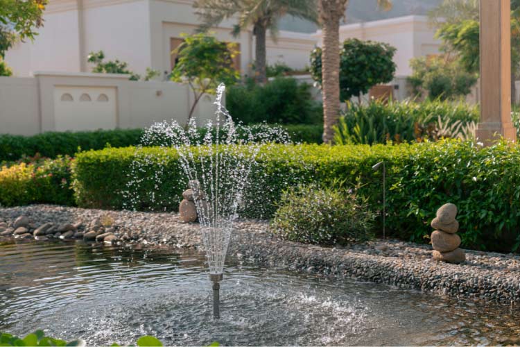 a simple DIY waterfall or small fountain can make to your pond