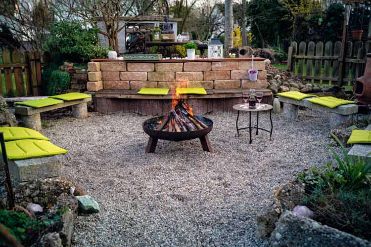Lay river rocks around your fire pit area to enhance its beauty