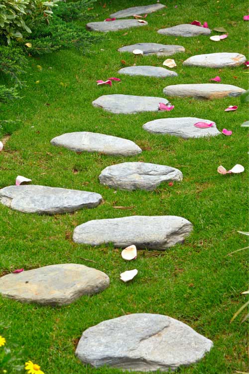 A stone pathway helps with drainage to prevent puddles