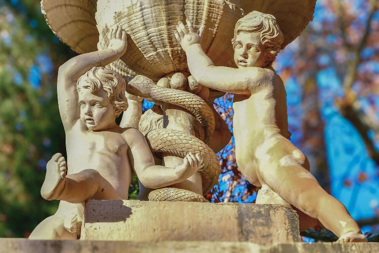 a statement statue or sculpture can transform your circular driveway into a focal point