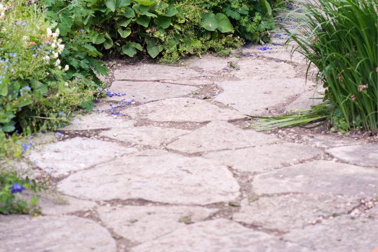 Flagstone on sand works well for seating areas and pathways
