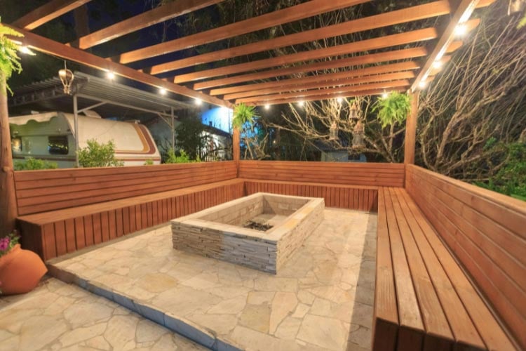 A square paver fire pit screams more outdoor lounge and less campfire