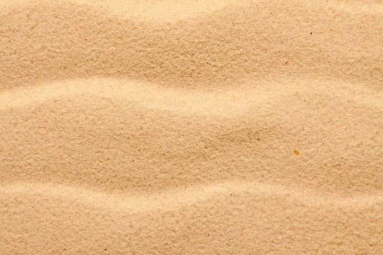 Sand is without a doubt the cheapest material you could use in the place of concrete