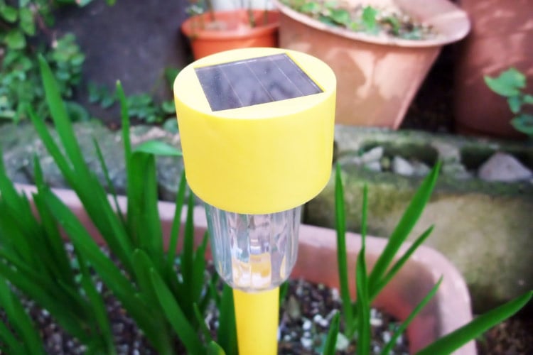 Lighting is just as effective as gravel when it comes to freshening up a space with a low budget