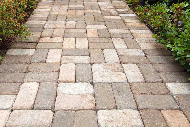 Level the gravel to make it as flat and even as you can and lay the bricks in rows