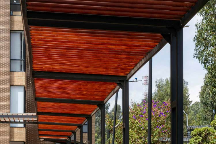 Cantilevered means that only one side of a beam is fixed to a solid standing structure