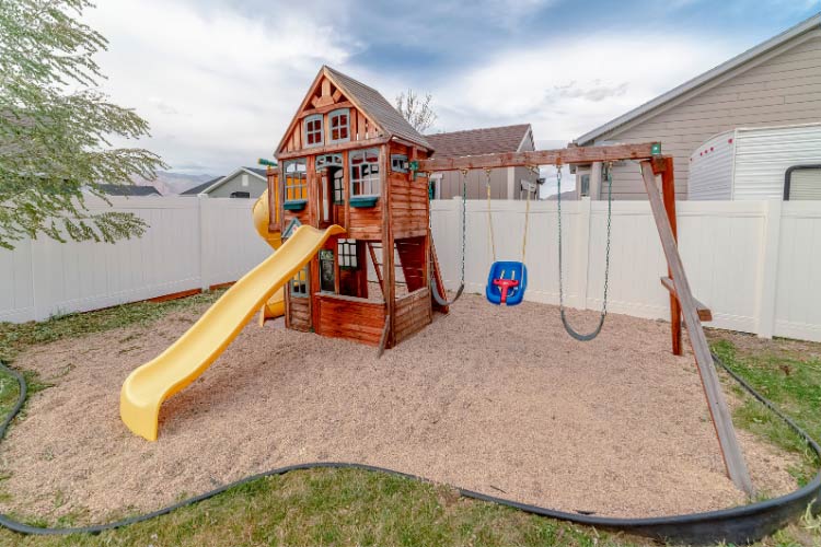 Construct square or rectangular decks from treated lumber set on concrete footings at different heights of the slope