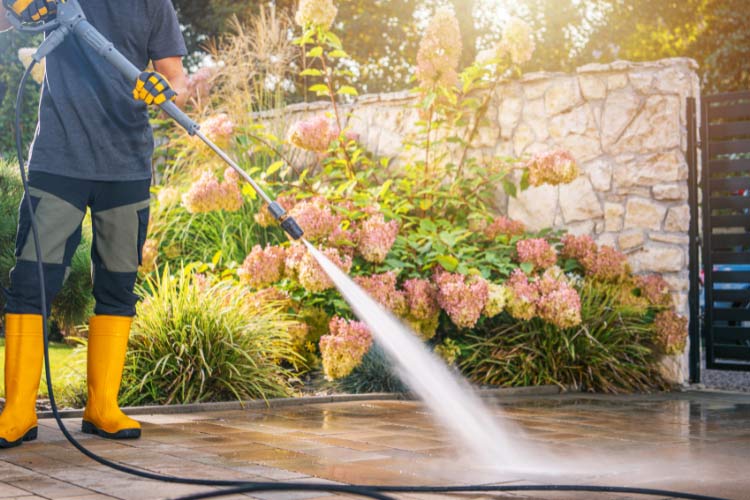Use a pressure washer to blast away grime in joints