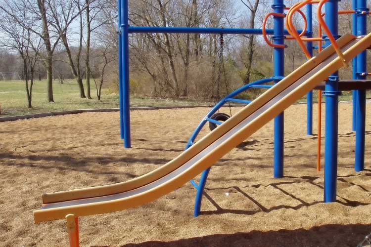 You can never go wrong with a slide that ends in a sandbox