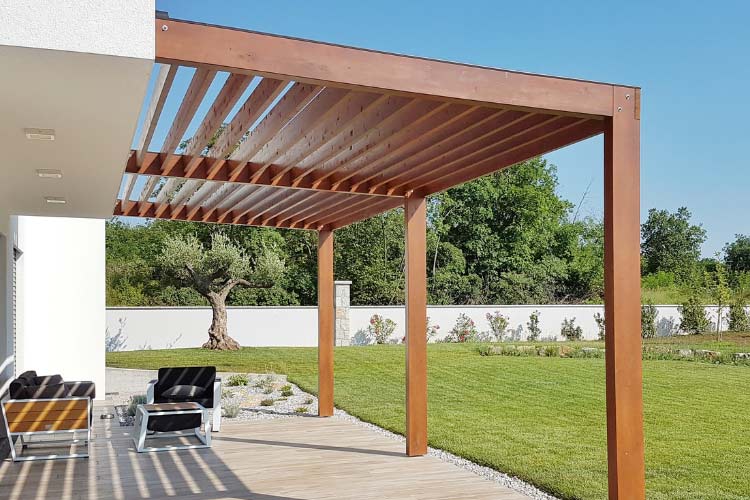With a wood slat pergola you say no to wide rafters and yes to narrow boards that are spaced closely together