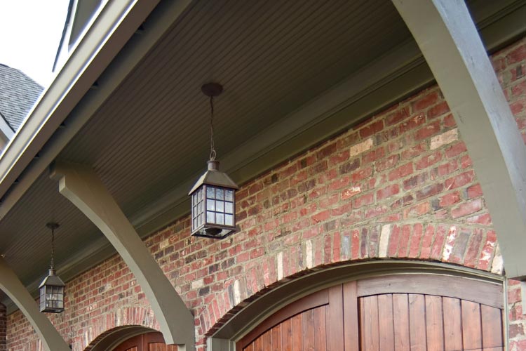 An eyebrow pergola can take your garage from plain to dramatic